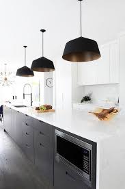 Long White Quartz Kitchen Island With A Waterfall Feature And Espresso Stained Drawers Transitional Kitchen Design Kitchen Design Kitchen Interior Inspiration