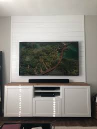 Hanging pictures or mirrors on a wall with a wire like this will do in a pinch, but there are better ways. Besta Tv Cabinet W Wood Top And Shiplap Wall Ikeahacks