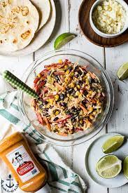 Despite the name, this would be welcome in almost any situation where you'd serve coleslaw. Blackened Fish Tacos With Southwest Slaw The Beach House Kitchen