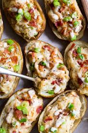 These Savory And Healthy Twice Baked Potatoes Are Loaded Up With A Chicken Caesar Filling That Will Have Yo Full Meal Recipes Paleo Potato Baked Potato Recipes