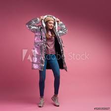 Topping sweet young girls solo pictures. Fashionable And Modern Young Woman In A Puffy Light Down Jacket Throws A Hood Over Her Head Sponsored Woman Puffy Young F In 2020 Fashion Down Jacket Women