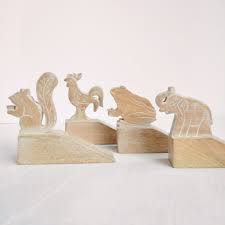 Door stops mount to a floor, wall, or door. Carved Wood Door Stop Dogwood Hill Gifts