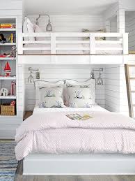 In A Small Room A Dual Bunk Bed Makes Space For The Whole Family The Queen Size Bed On The Bottom And Twin Bed On Bunk Bed Designs Bed Design