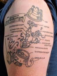 Flaming chevy logo and rally flags tattoo on half sleeve. This Is Why Cool Ink And Old Iron Go Together