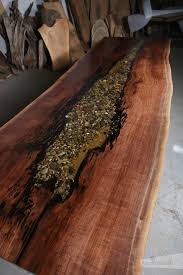 Well, this design includes stones in the that beautiful, epoxy middle. Walnut Live Edge Single Slab Dining Table With Epoxy Hole K Shape Legs Anglewood Live Edge Custom Furniture Toronto