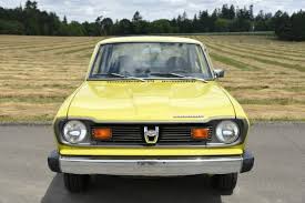 Image result for Herald Yellow 1974 Subaru