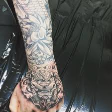 Black And Grey Foo Dog Hand Tattoo Hubby Added Onto His Japanese Themed Half Sleeve Japanese Foo Dog Handtattoos Japanese Foodog Hand Tattoos Body Art Tattoos Tattoos