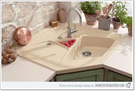 A single, large bowl provides ample space to soak and wash cookware, while a sloped base to a single offset drain minimizes water pooling. 25 Creative Corner Kitchen Sink Design Ideas