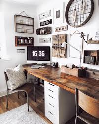 Farmhouse Fanatics On Instagram Tag Someone Who Would Love To Work In This Rustic Office Space Rustic Home Offices Home Office Decor Home Office Design A neutral and cozy farmhouse home office with a wooden desk and a table, neutral upholstered chairs, a vintage chandelier, macrame art on the wall.