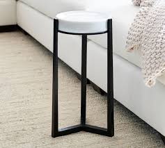 Round coffee table, perfect example of art deco' style, with engraved top and enhanced by elegant decor. Cori Glass Accent Side Table Pottery Barn