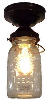 Mason jars are extremely versatile, and people use them for virtually anything. Mason Jar Ceiling Light Vintage Quart Single Eclectic Flush Mount Ceiling Lighting By The Lamp Goods