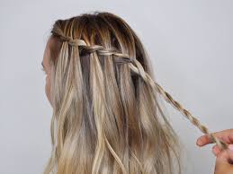 The double waterfall braid lock with bun look How To Do A Waterfall Braid Real Simple