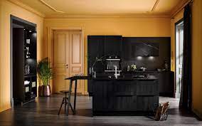 On an adjacent wall, a stainless steel hood is fixed to hammered metal backsplash by porcelanosa between white upper cabinets and above a stainless steel integrated gas cooktop.the kitchen is also fitted with a stainless steel double oven mounted to glossy white lacquered cabinets completed with a flat panel television. Hacker Classic Collection Innovative Kitchen Ideas