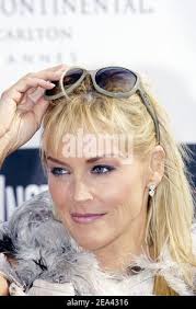 Sharon Stone poses for the photographers with 2005 winners Kelly Reilly and  Jonathan Rhys Meyers during the Chopard Trophy Party in Cannes