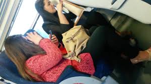 Amateurs in slingbacks pumping feet on train - Feet9