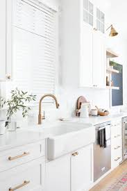 Maybe you would like to learn more about one of these? White Kitchen With Brass Hardware And Faucet Hazel And Brown Interior Design Kitchen Kitchen Interior Brass Kitchen Hardware