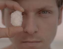 A Man Holding Salt Crystals Covering His Eye · Free Stock Photo