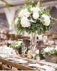 Shop wayfair for all the best wedding flower centerpieces & decorations. White And Green Rustic Centerpieces In Vail Featuring Roses An White Wedding Flowers Centerpieces Hydrangea Centerpiece Wedding Green And White Wedding Flowers