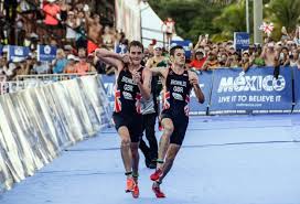 Olympic silver and bronze in triathlon. Watch Alastair Brownlee Helps Brother Jonny Over Line After Triathlon Collapse