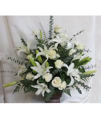White flowers are common however many people choose a colour or flower type they know the deceased would have loved. White Funeral Flowers Arrangement Sympathy Urn