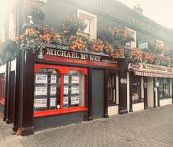 McWey Property Consultants & Auctioneers logo