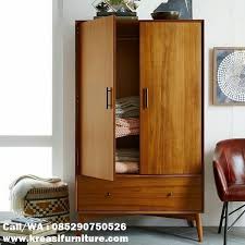 Produk tambahan untuk pelengkap furniture ruang kamar penginapan standard melati maupun ruang kamar anak pada rumah atau kos kos an selain mebel seperti tempat tidur, model furniture dari produk lemari pakaian bahan kayu jati 2 pintu model anak di desain secara sederhana melalui pintu model jendela jalusi & di buat untuk melengkapi ruangan kamar yang hanya memiliki ukuran tidak terlalu luas. Lemari Pakaian Anak Model Scandinavian Kreasi Furniture Jepara Kreasi Furniture Jepara