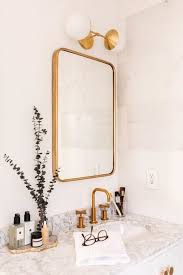The different tile sizes provide some interesting flow and movement to the space, and the gray paint around the alcove shower (note the marble hex tile at the bottom there) highlights the veining really well. Decorating Details Glam Gold Modern Bathroom Refresh Marble Bathroom Boho Bathroom