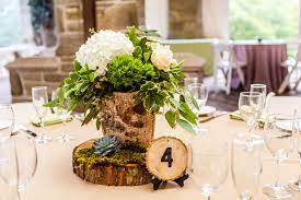 The wedding flower centerpieces, bouquets, and arrangements are out of this world gorgeous, take a look at these 48. Birch Wood Centerpieces With Hydrangeas And Greenery And Wood Slab Table Numbers Wood Centerpieces Wood Centerpieces Wedding Driftwood Centerpiece