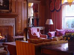 Photo of a medium sized classic open plan living room in london with a standard fireplace, a metal fireplace. In A London Drawing Room Wiharyo