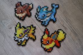 133 Evoli Evee 134 Aquali Vaporeon 135 Voltali Jolteon 136 Pyroli Flareon Perler Beads By Vicsene Perler Bead Art Pokemon Bead Pokemon Perler Beads