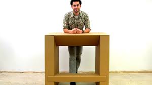 Convert any desk or table into a standing desk with the chairigami cardboard table topper. This Cheap Strong Cardboard Standing Desk Will Let You Ditch Your Dea