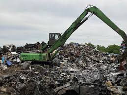 Firefighters prevent blaze from igniting mountain of junk cars in  Plainfield Township