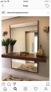 Floating Shelf And Large Mirror On Wall Behind Shelf Exposed Above And Below Shelf Likely Installed In Entrance Of A Home Home Decor House Interior Home
