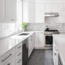 I shared the story of how the sweet little industrial cart above recently came to live in our kitchen right here, and now i can't imagine my kitchen functioning without it! Gray Floor White Cabinet Ideas Houzz