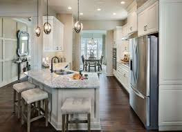 The location and size of a kitchen island are important to its function. Traditional White Cabinet Kitchen With Angled Peninsula And Cushioned Bar Stools Curved Kitchen Kitchen Peninsula Angled Kitchen