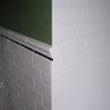 White ceramic bullnose wall tile. 1