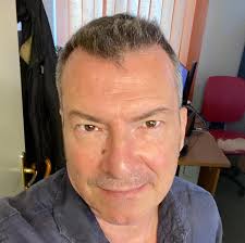 How often should a bassist and drummer have solos in a three-piece band?