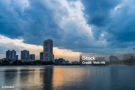 Linh Dam Lake At Sunset With Cloudy Sky Hanoi Cityscape Stock Photo