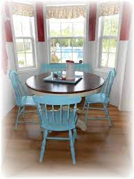 Flowers in a bucket, glass vintage bottles on wooden background Cottage Style Kitchen Table And Chairs Eclectic Kitchen Raleigh By Lisa S Creative Designs Houzz