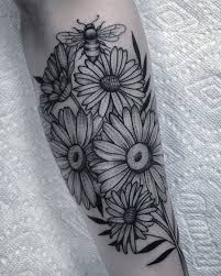 You can find daisy tattoos of various colors by many people. Daisies Asters And A Bee For The Sweetest Alyson Cool Shoulder Tattoos Daisy Flower Tattoos Flower Tattoo Shoulder