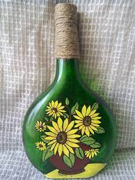 Acrylic Painting On Bottle The Bottle Is Painted With Acrylic Paint And The Jute Twine Around The Neck Of The Bo Bottle Painting Bottle Art Diy Bottle Crafts