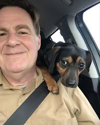 For twelve long years, rain or shine, the postal worker kept his route. And  every single day, waiting by the fence with a stick in his mouth, was Max.  Their daily meeting,