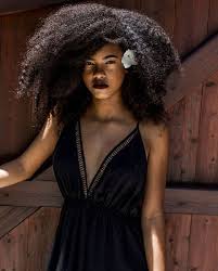 Curly afro hair, african american portrait, dark skinned female face with curly hair afro, traditional ethnic earrings and red lips, isolated on white background. Farahrichardson On Instagram Big Hair Afro Hair Natural Hair Kinky Hair Kinky Curly Hair Long Hair Long Afro Hair Long Kinky Hair Long Natural Hair Texture Kinky Curly Hair Big Hair