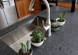 Then, we were told that our neighborhood standard for counter tops was granite… Why We Picked Leathered Granite Countertops Tag Tibby Design