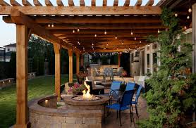Fire pit under a covered patio. How To Use String Lights To Create Fantastic Outdoor Setups