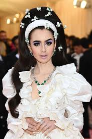 Lily Collins Attends The 2019 Met Gala With An Elevated Chic Pastel Look Makeup Artist Fiona Stiles Used Grandoise Li Met Gala Dresses Met Gala Looks Met Gala
