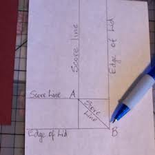 Score a piece of 7½x7½in cardstock at 2½ and 5in on both sides. Explosion Box Album