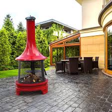 The fireplace is meshed, which allows for 360 views of the fire, and it can be easily accessed through a latch door in front. Outdoor Fireplace With Cooking Grill