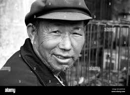 Chinese man traditional dress Black and White Stock Photos & Images