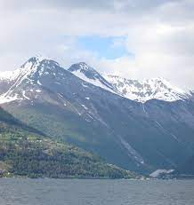 It is a fertile valley (known for strawberries and fruit) surrounded by alpine mountains. Valldalen Wikipedia